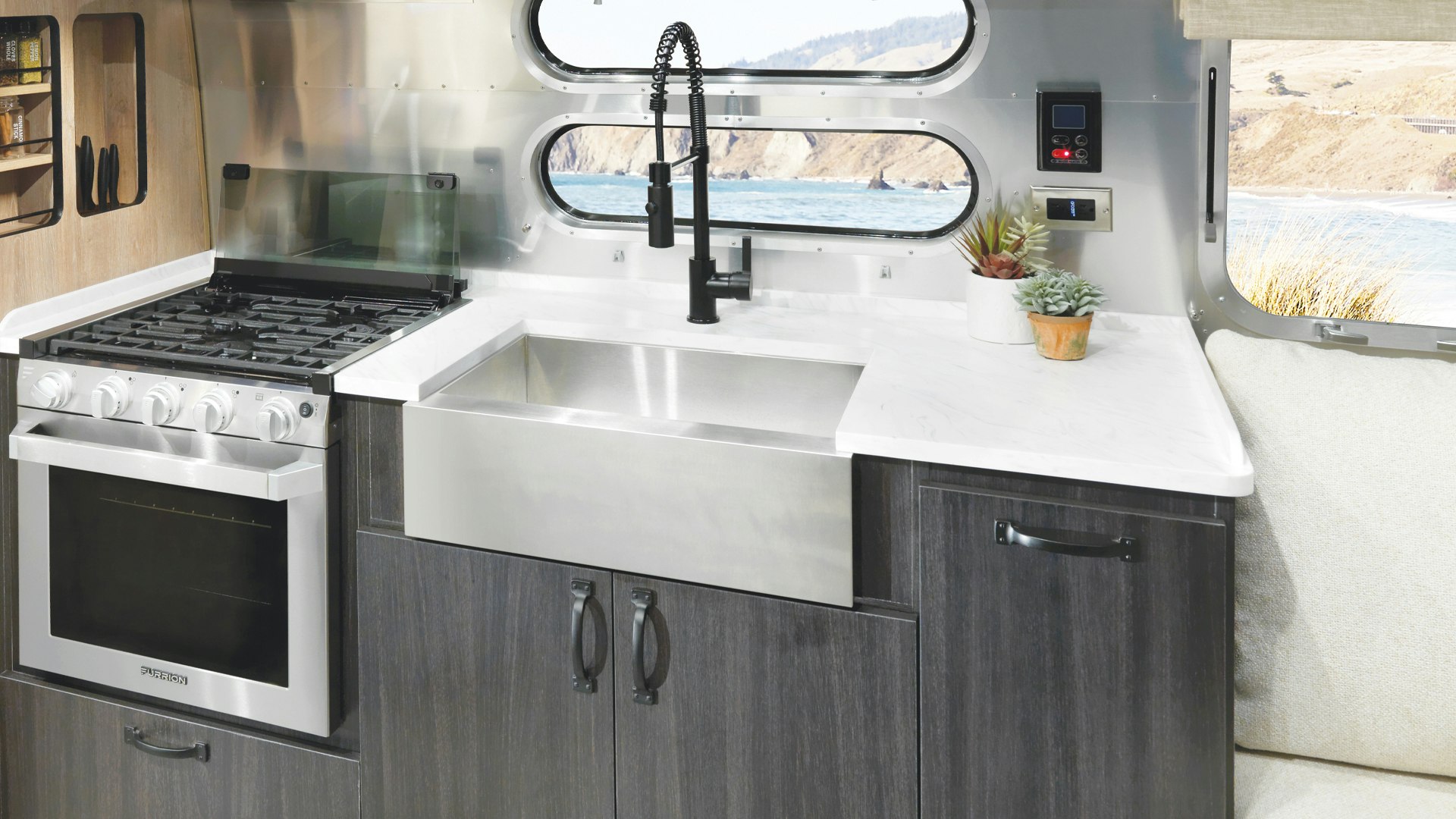 Airstream Pottery Barn Special Edition Travel Trailer kitchen sink with ocean in the background